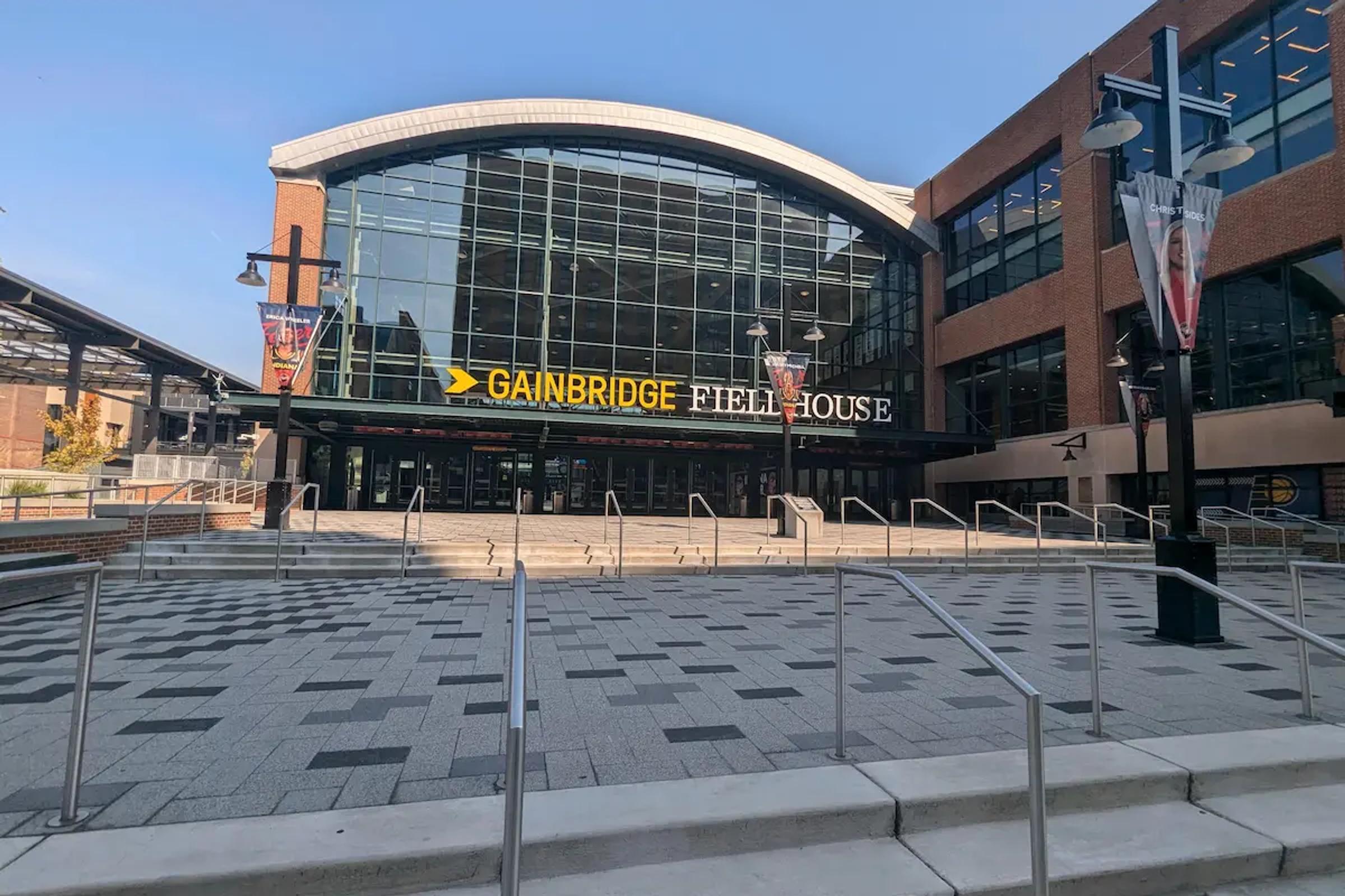 The main entrance to Gainbridge Fieldhouse in Indianapolis on a sunny day.