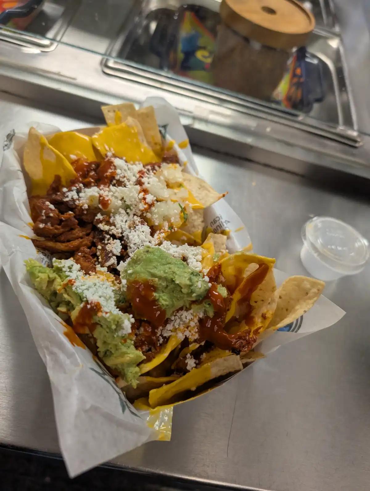 Loaded nachos with carne asada, guacamole, and queso at the American Airlines Center in Dallas.
