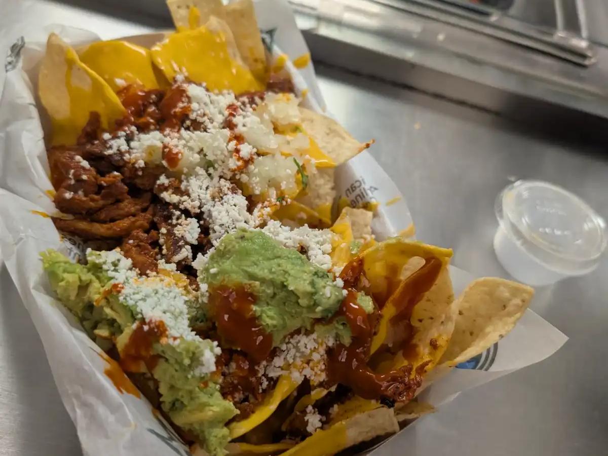 Loaded nachos with carne asada, guacamole, and queso at the American Airlines Center in Dallas.
