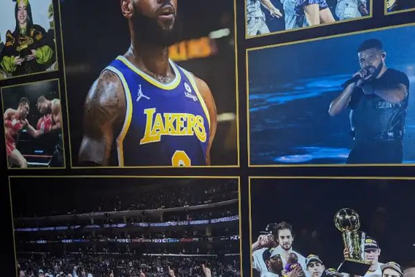 Wall of fame at Crypto.com Arena in LA, with photos of LeBron, Taylor Swift, Drake, and championship teams.