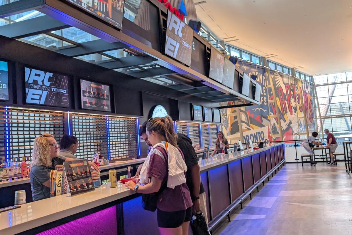 Ordering drinks at the Toronto Tempo bar inside Scotiabank Arena before the game.