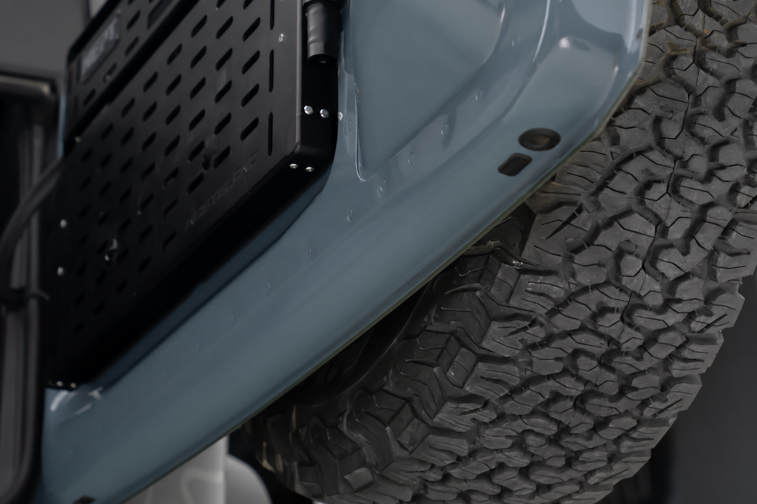 The tailgate swings its full arc. In a tight spot it finds whatever is parked behind you.