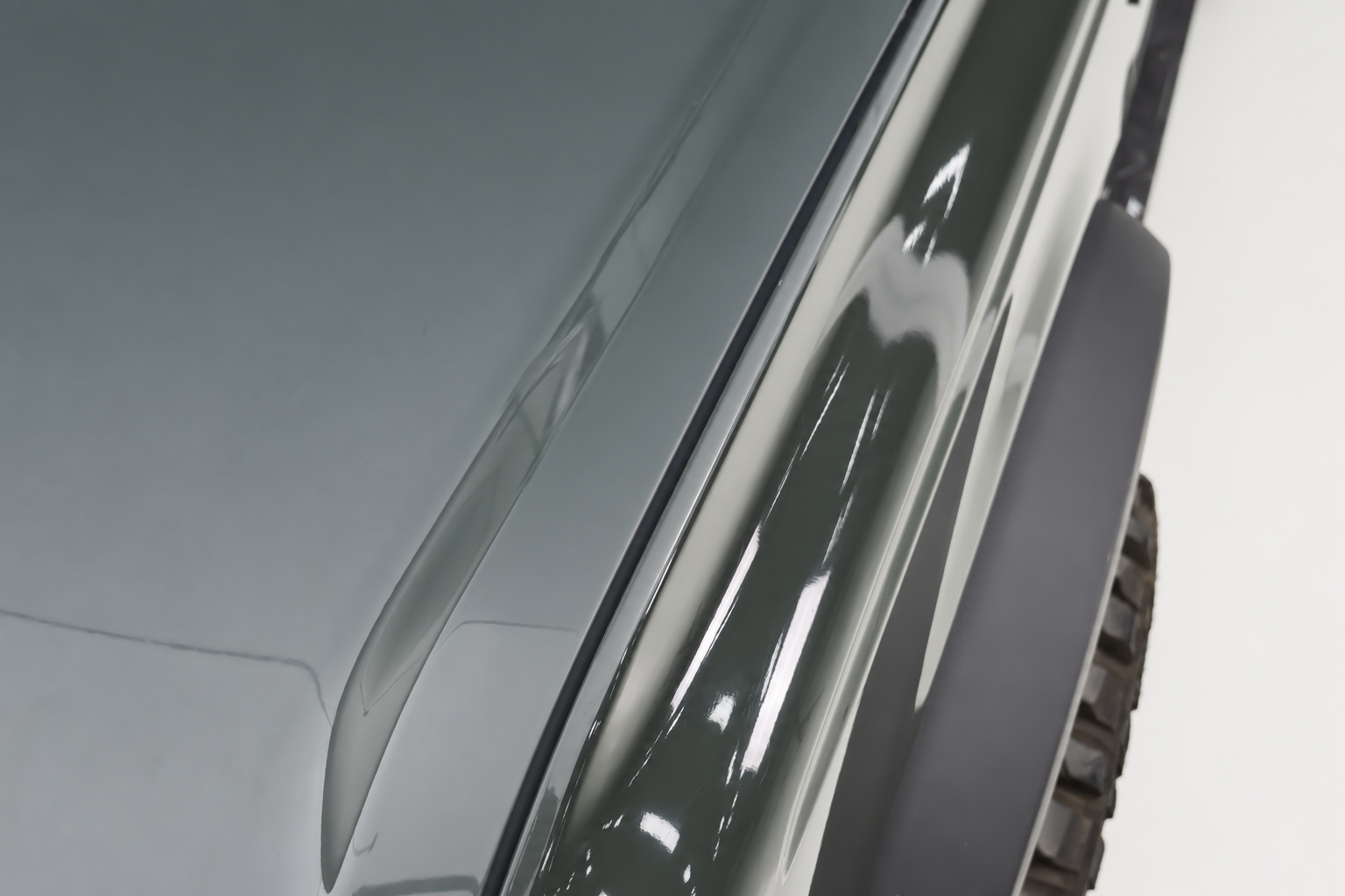 Nothing on the hood corner. A branch that clears the bumper arrives at windscreen height.