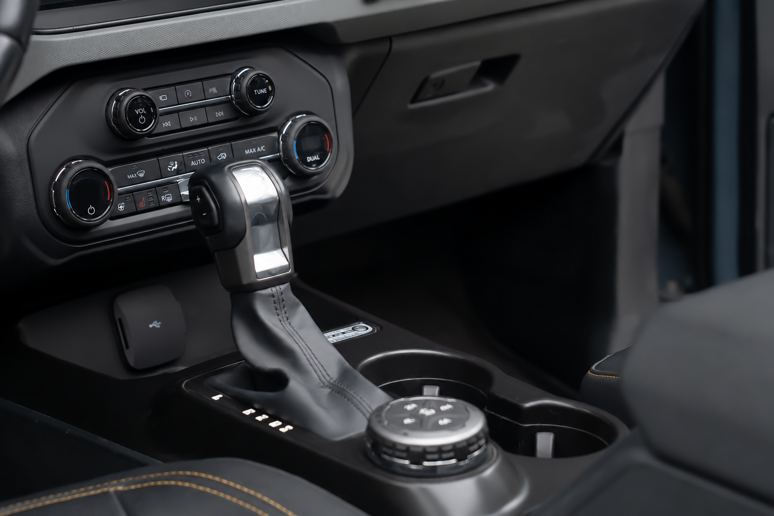 Nothing to hold on to. On rough ground your passenger braces a hand flat on the dash.
