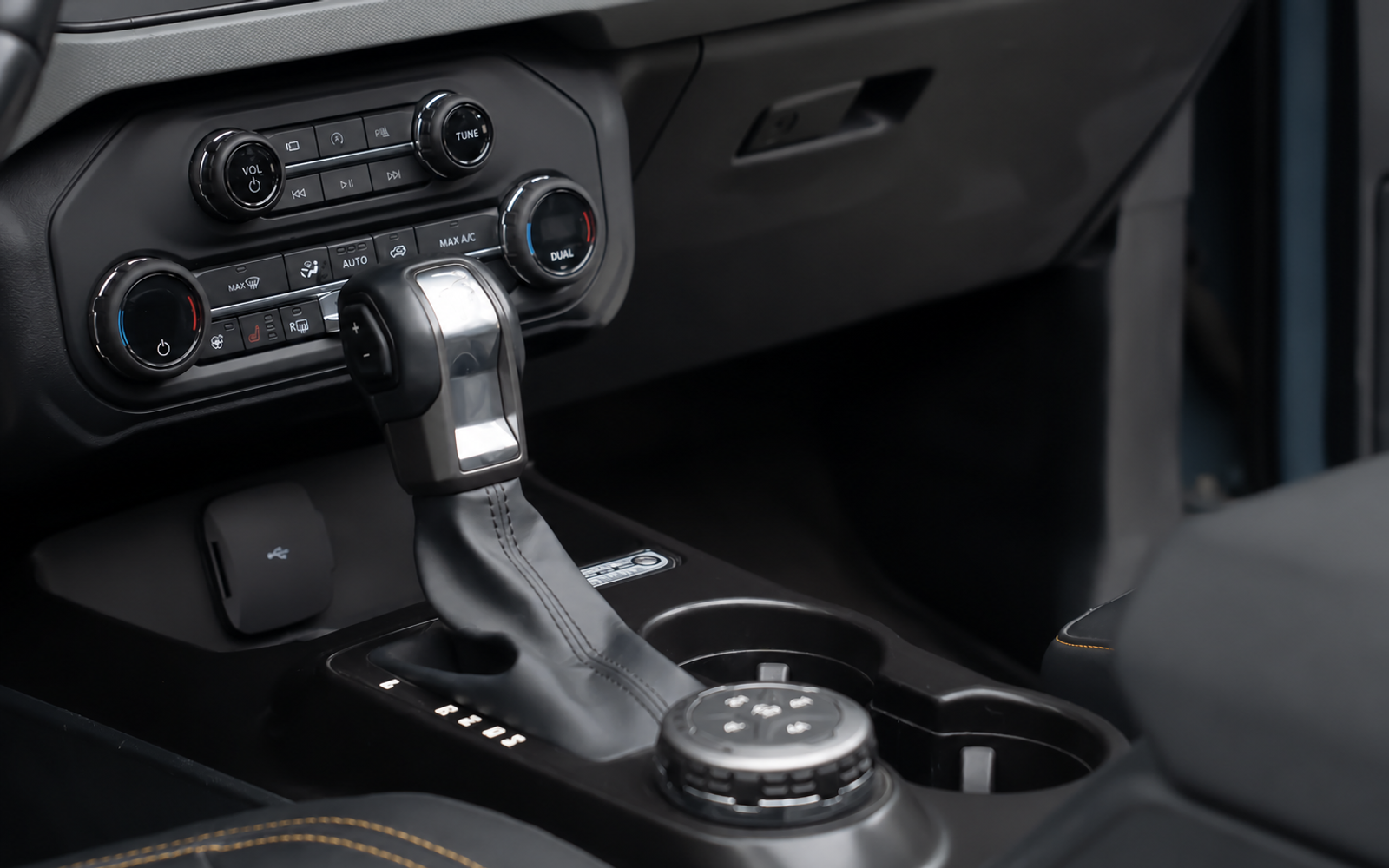 Nothing to hold on to. On rough ground your passenger braces a hand flat on the dash.