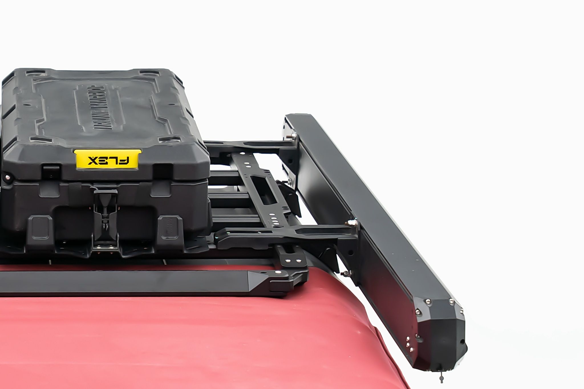 The case rides out past the edge. The rack top stays free for boxes.