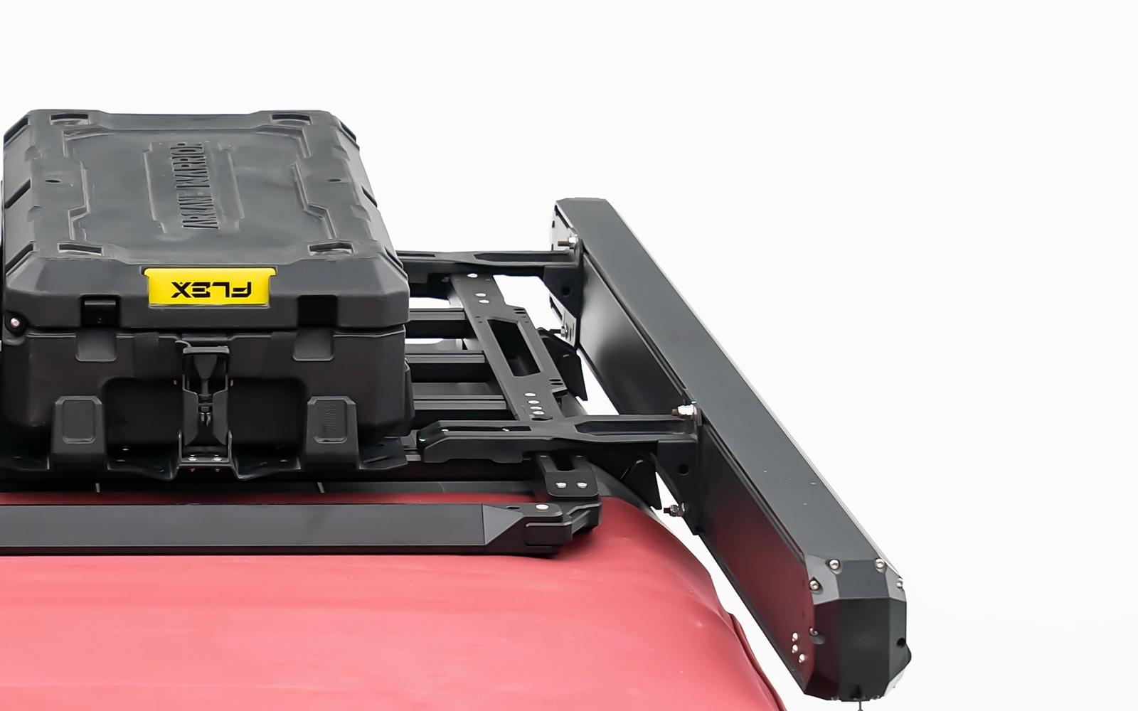 The case rides out past the edge. The rack top stays free for boxes.