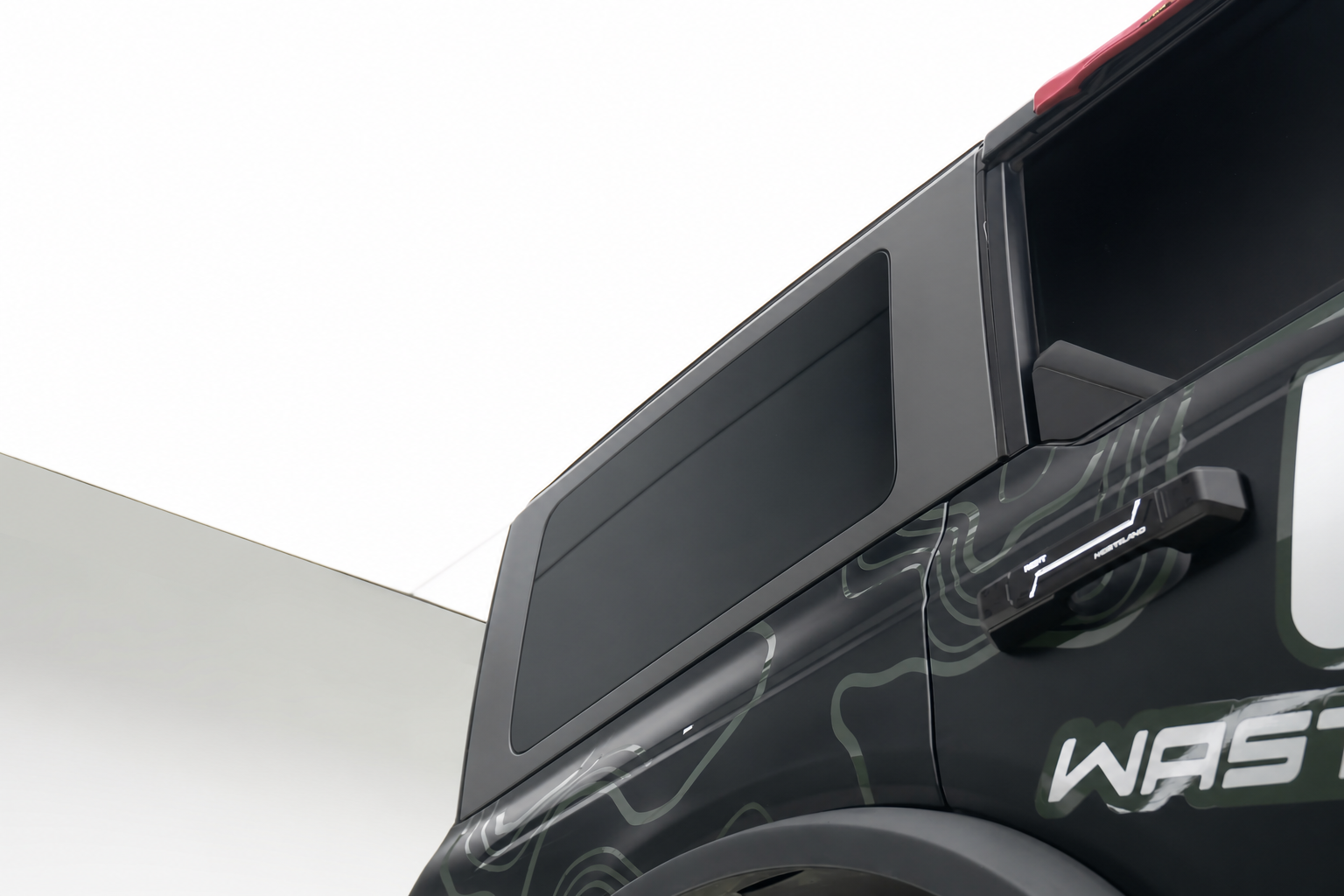 Bare rear panel. A tyre makes a poor first step.