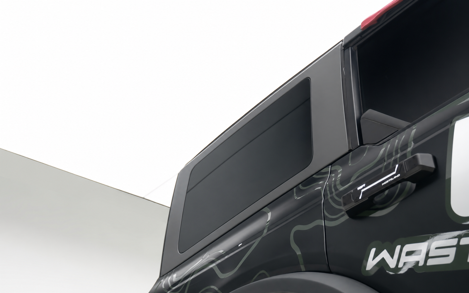 Bare rear panel. A tyre makes a poor first step.
