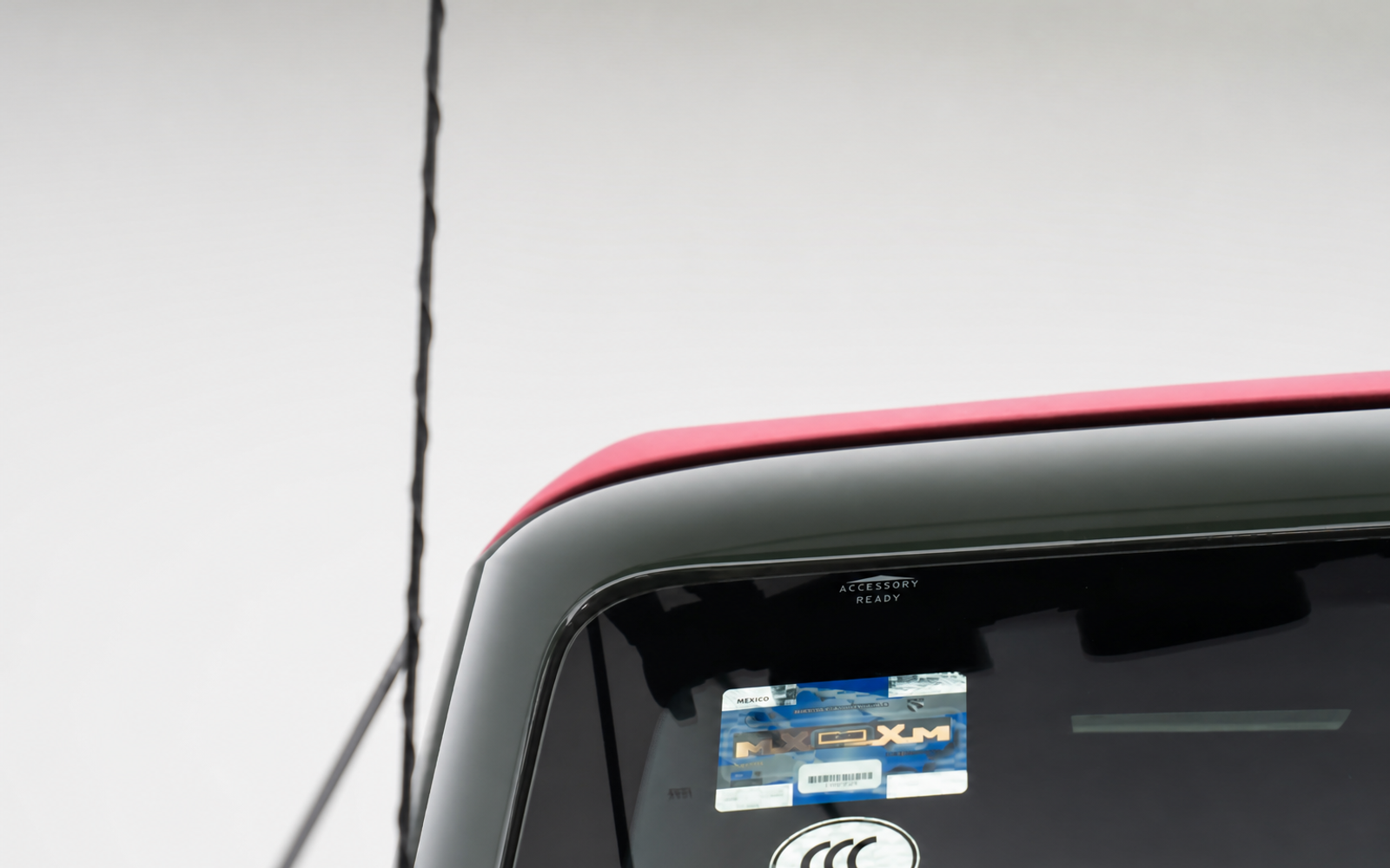 Nothing above the windscreen. A light bar mounted low bounces glare off the hood back at you.