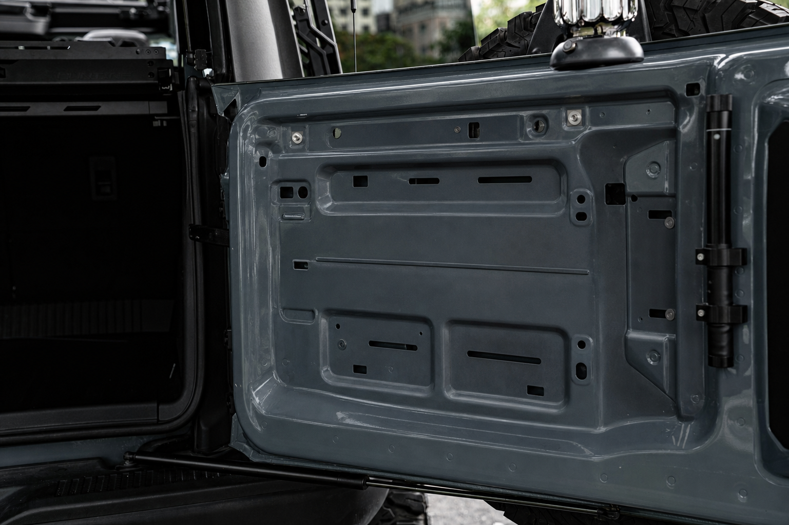Tailgate down, nothing on it. You cook wherever you can balance a pan.