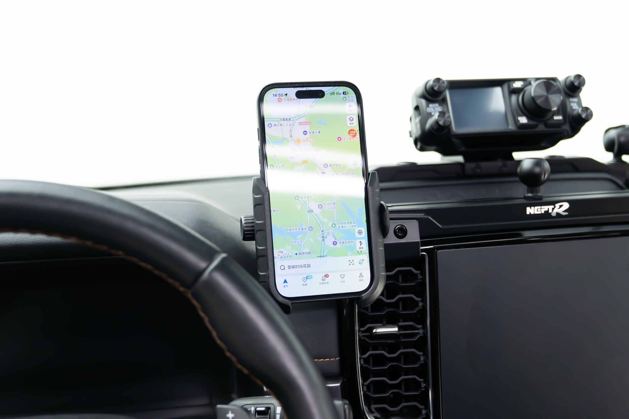 A frame that grips the screen's edges. The phone stays readable on a gravel road.