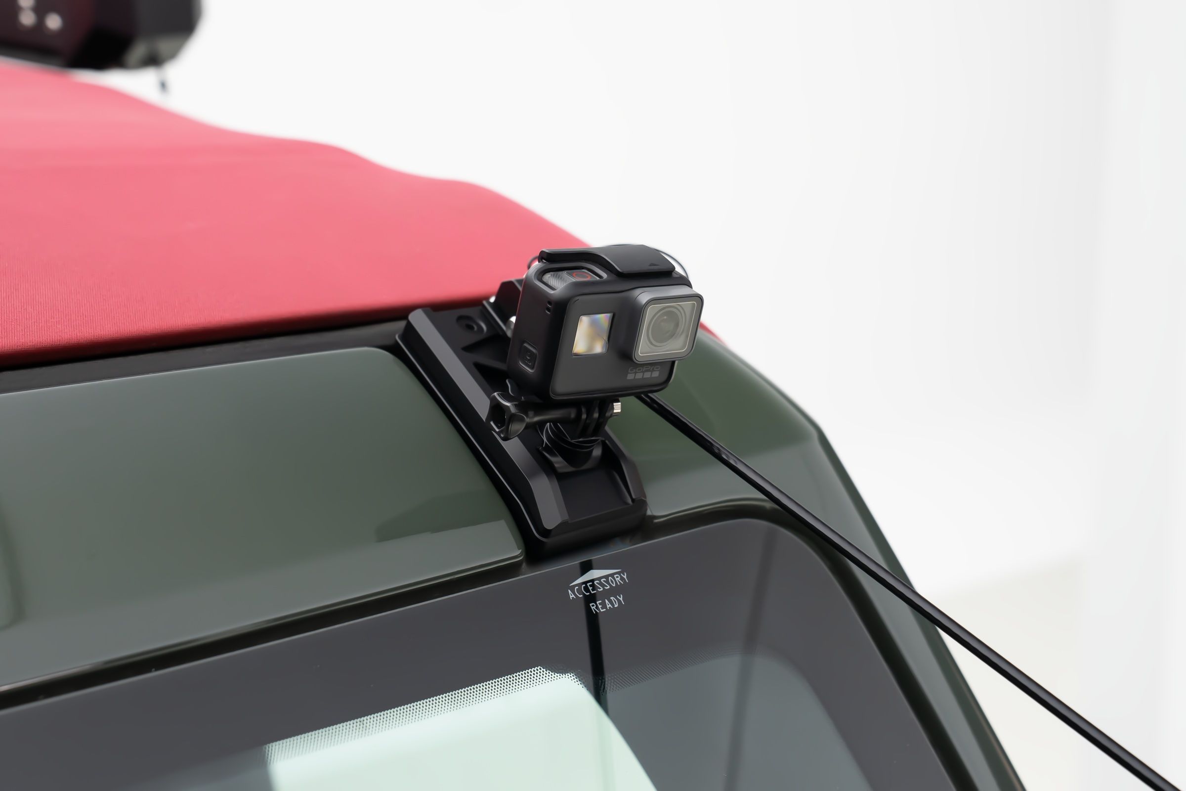 That top end, anchored to the roof. The hood still opens with the lines on.