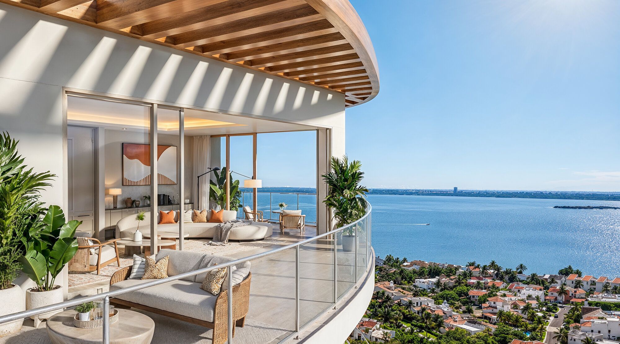 Architectural rendering of a curved private balcony overlooking Puerto Cancún's rooftops and the bay