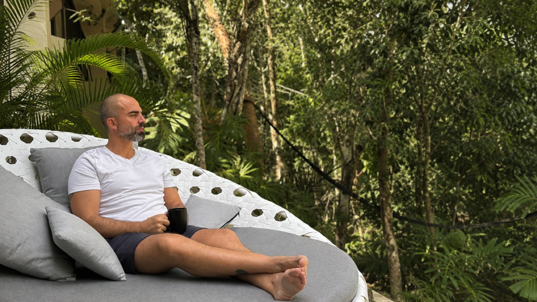 Joaquín Martínez enjoying coffee surrounded by the jungle at Kuyabeh in the Riviera Maya.