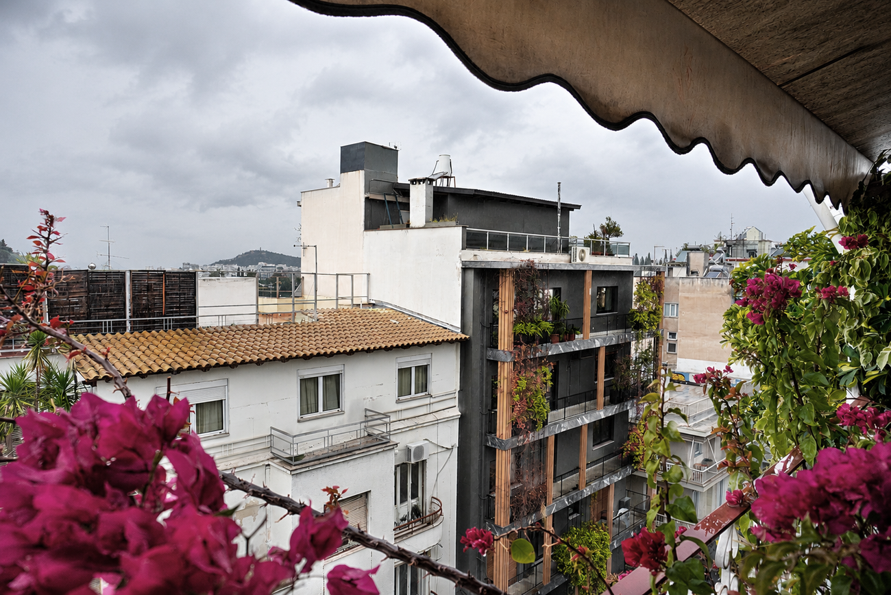 View toward the opposite side of the street. A later apartment building replaces an earlier two-story house, blocking the original view.