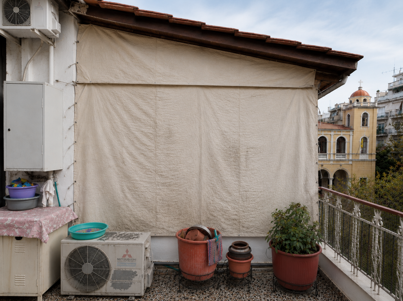 The enclosed balcony (tzamaria) added to the apartment.