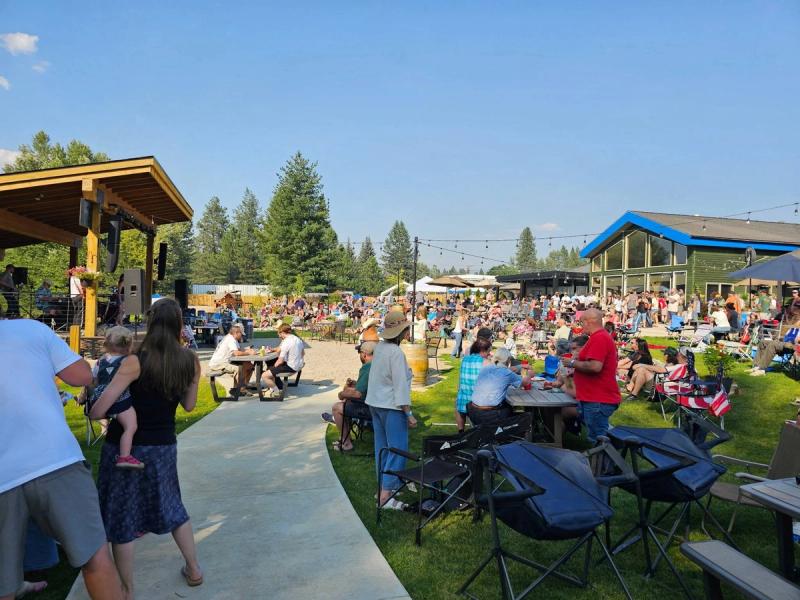 Crowds enjoy the Give Aways at the Blue Heron