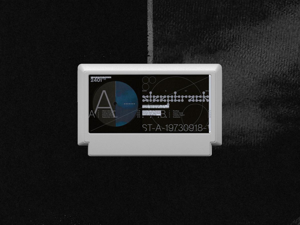 Light grey Famicom game cartridge, with a black label combining stylised “Sleeptrack” lettering, a blue vinyl record motif, track listings and fine geometric lines.