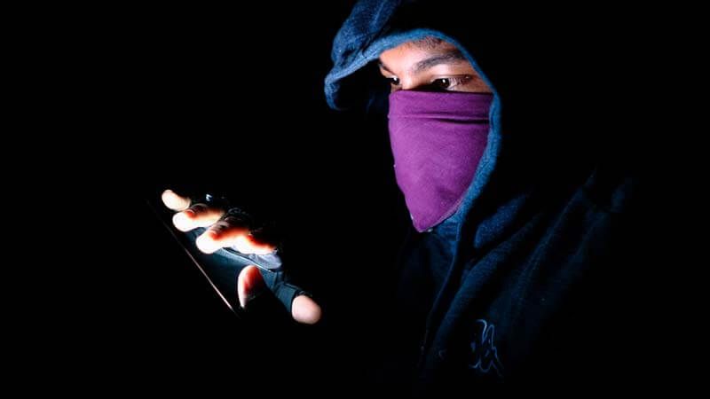Hacker with a purple mask