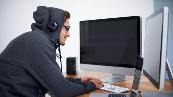Male hacker with headphones