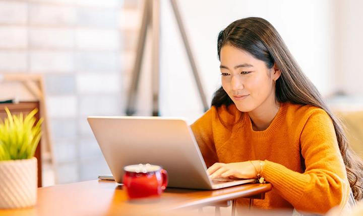 College student studying on laptop