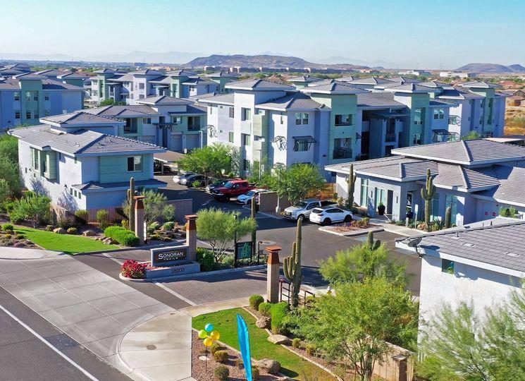 Multifamily community with mountains on the horizon
