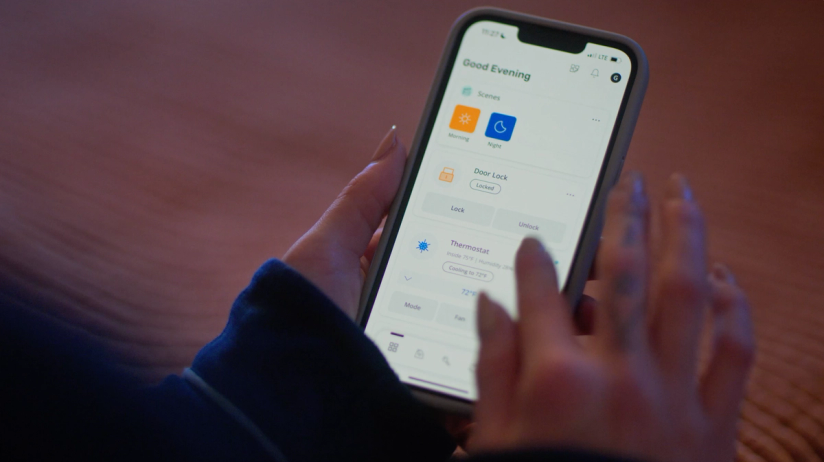 Apartment resident uses SmartRent app to control their smart home devices