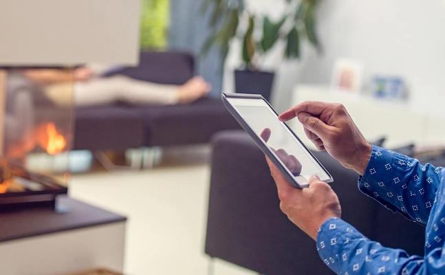 man using iPad in apartment