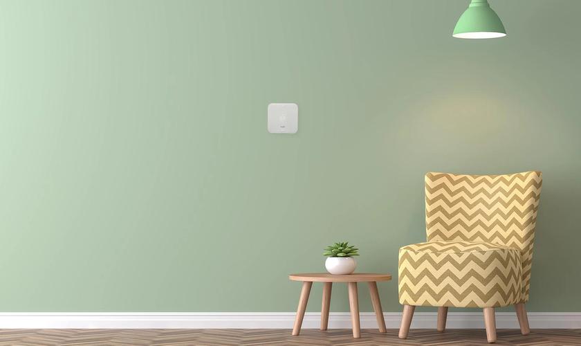 green wall with smart thermostat