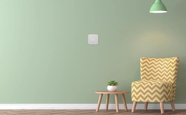 green wall with smart thermostat