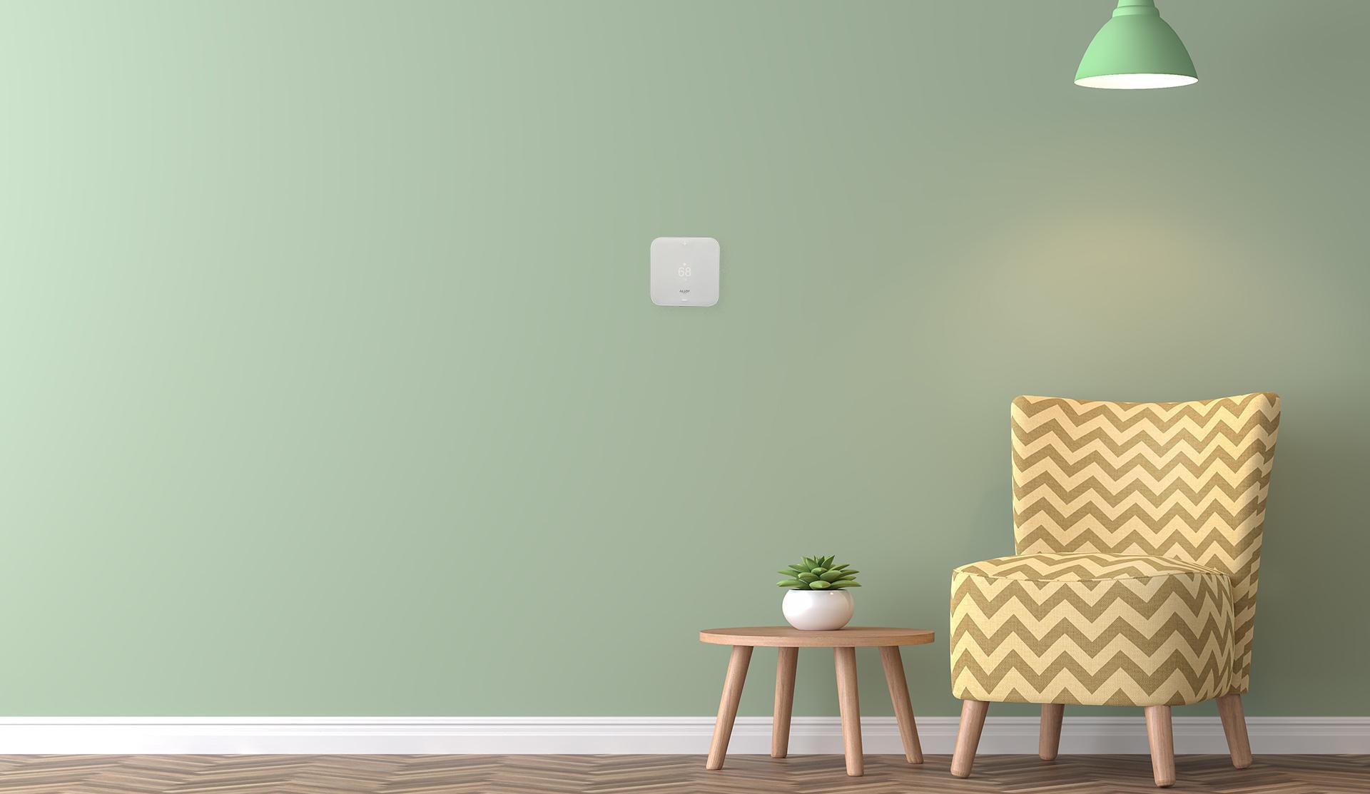 green wall with smart thermostat