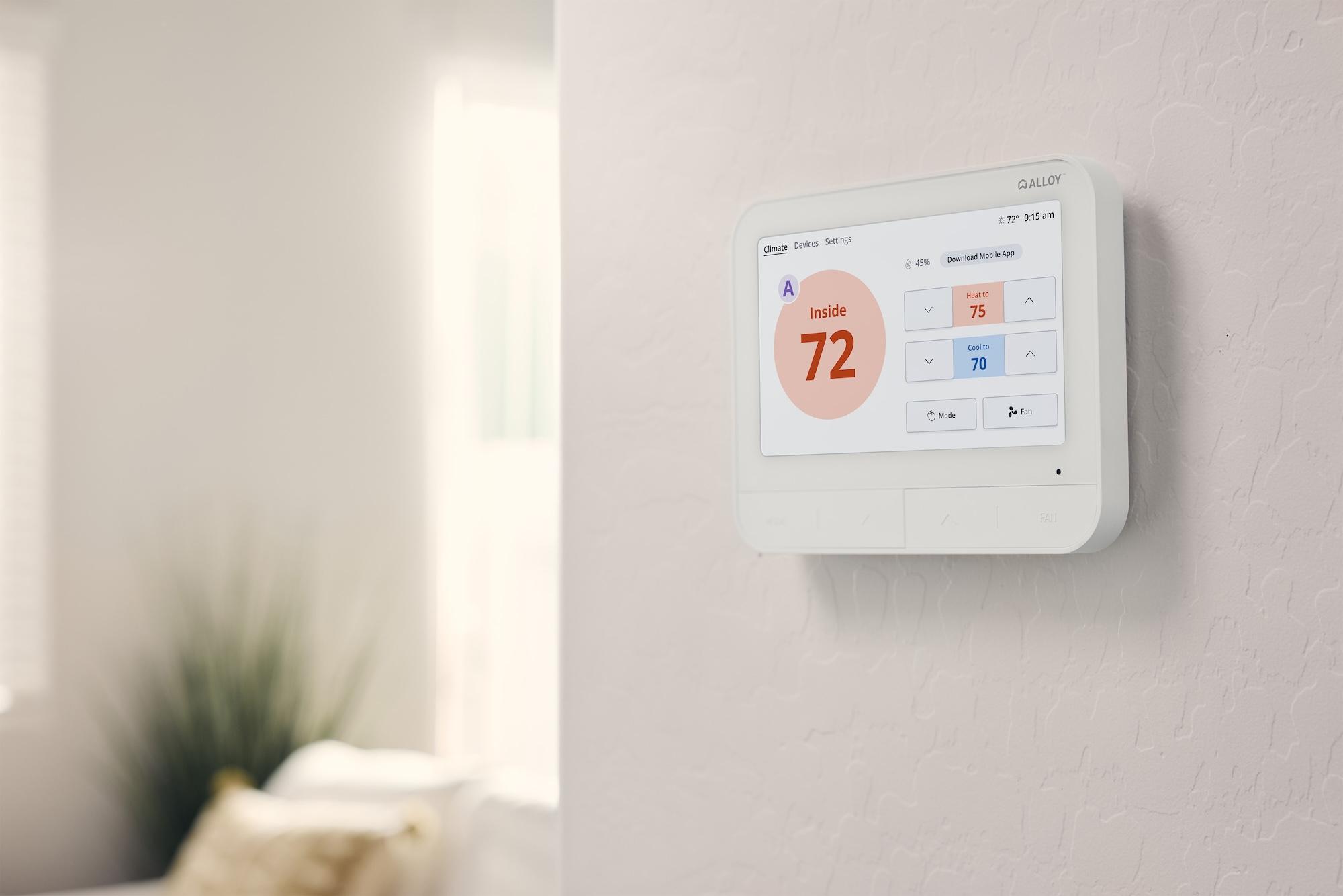 A SmartRent Fusion hub on the wall in an apartment unit.