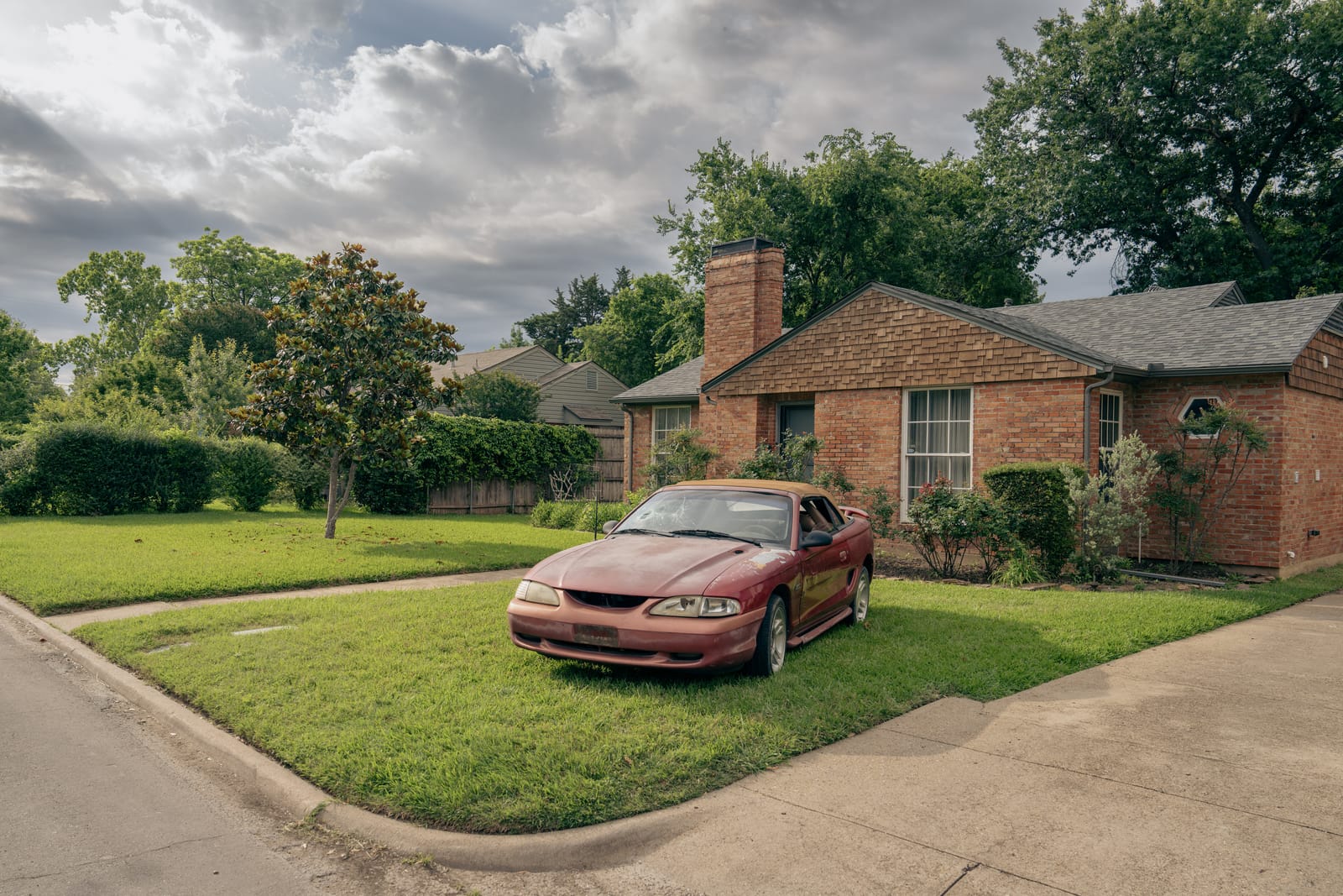 A donated car parked in front of a Dallas home