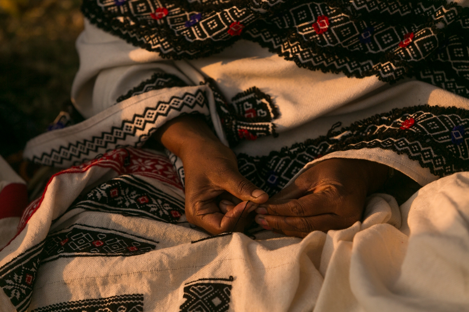 Close-up of traditional Toda embroidery being created using counted-thread techniques
