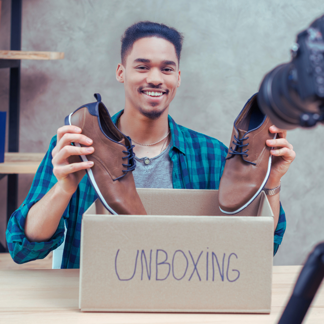 A micro-influencer creating an unboxing video of a brand’s product, emphasizing its authenticity over production quality.