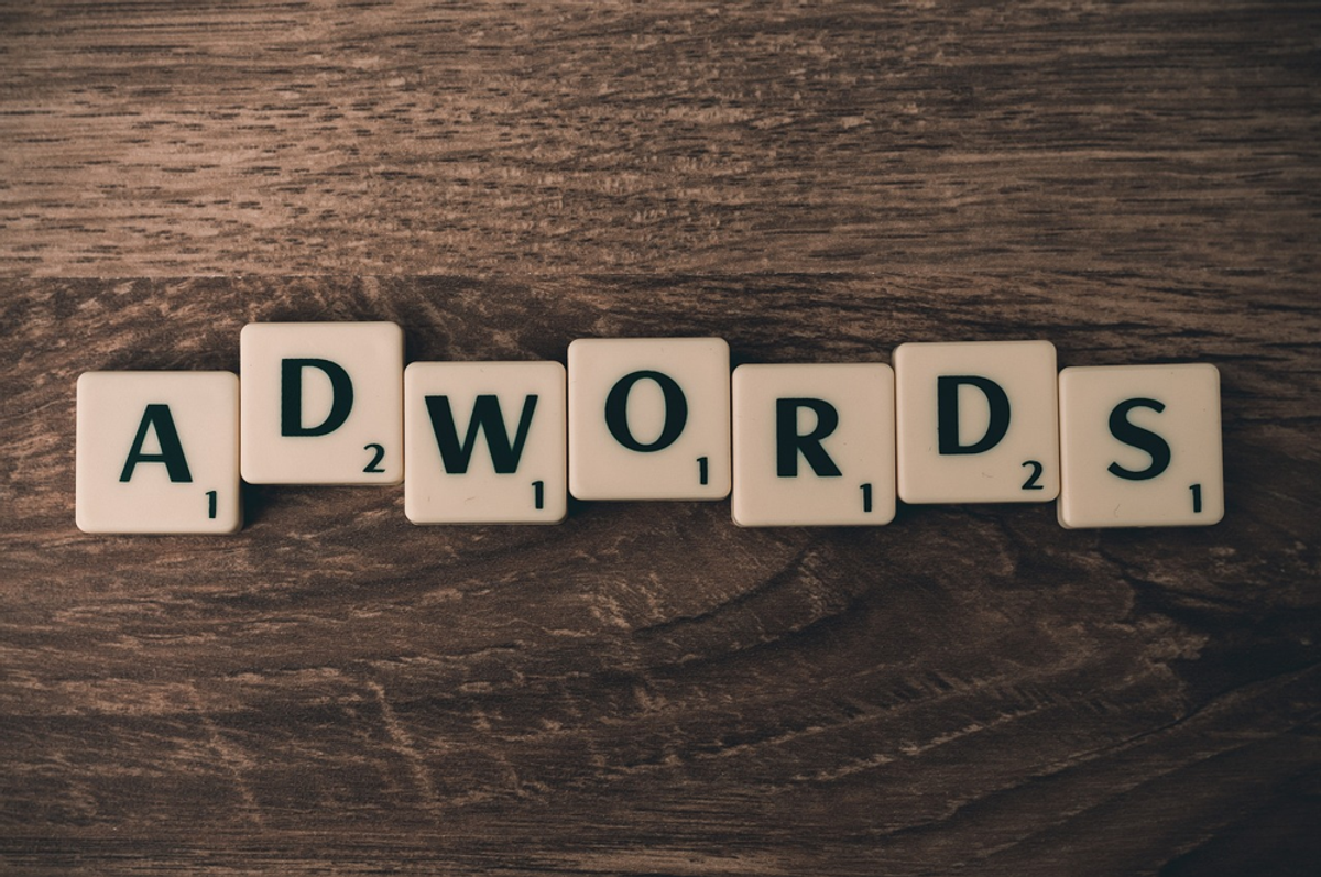 Scrabble tiles spelling “ADWORDS,” representing Google Ads and pay-per-click advertising.