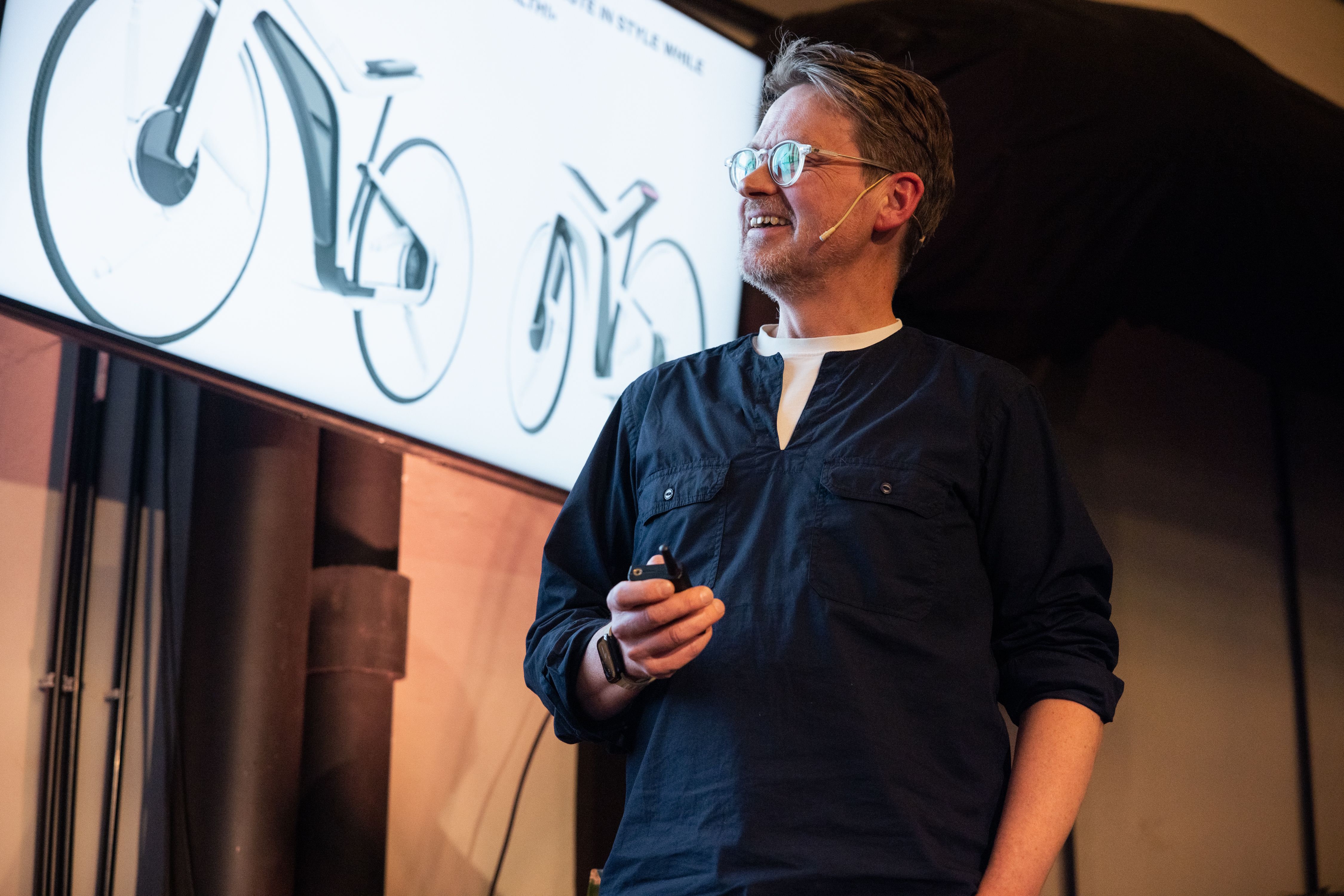 Anders Hansen of Whee! onstage at IxDA Oslo's meetup Nº 149, in the Atrium at MESH Youngstorget