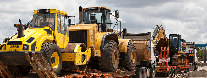 heavy equipment transport on truck
