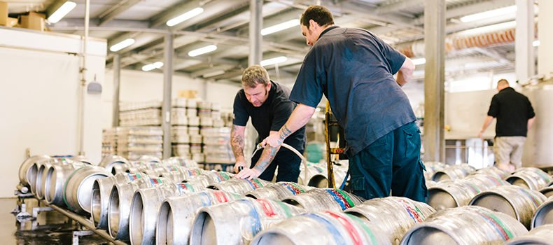 business shippers in warehouse preparing for shipment