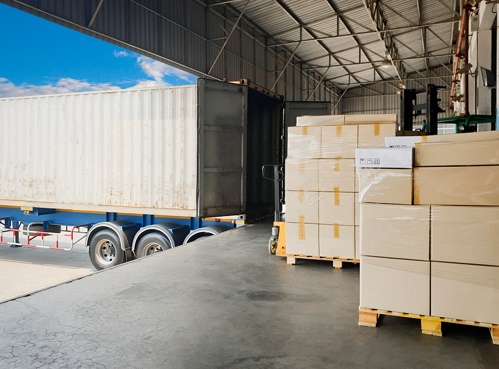 truck being loaded with pallets