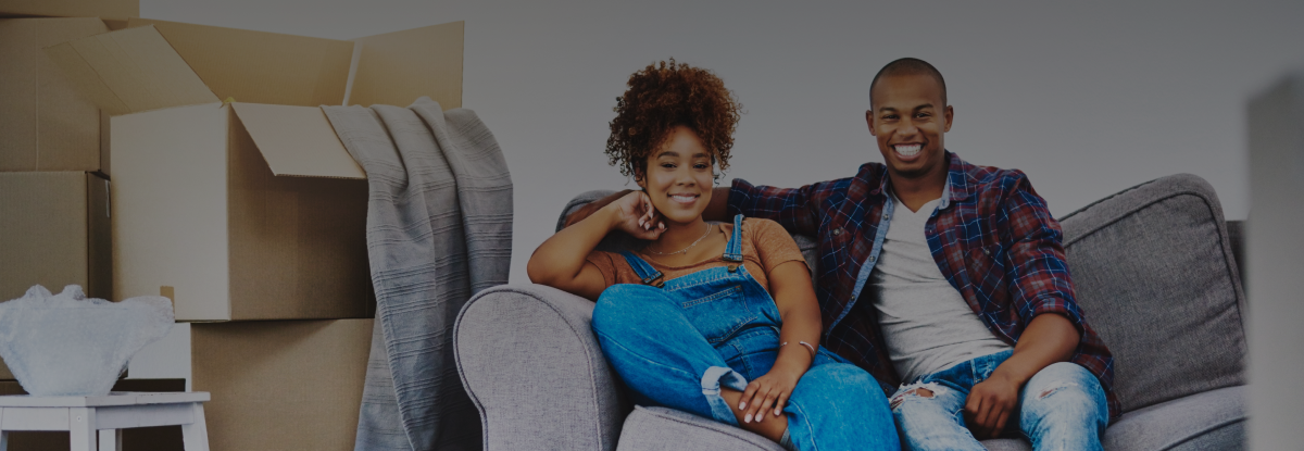 couple on couch in the middle of a move