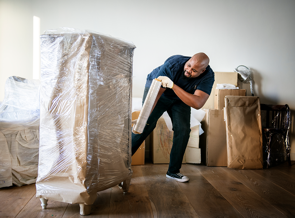 man carrying furniture