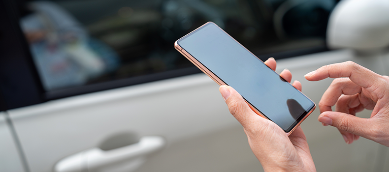 person reviewing vehicle shipping contract on mobile device