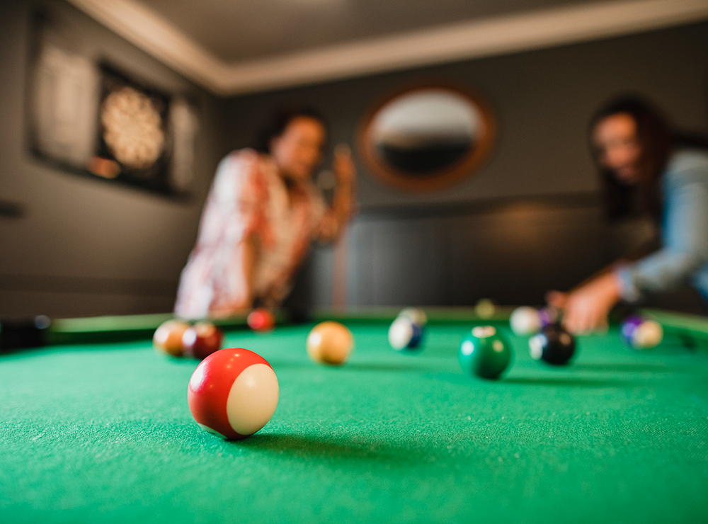 couple playing pool