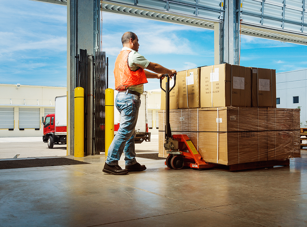 warehouse worker with pallet