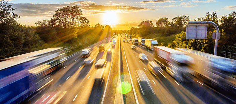 busy highway with trucks and cars