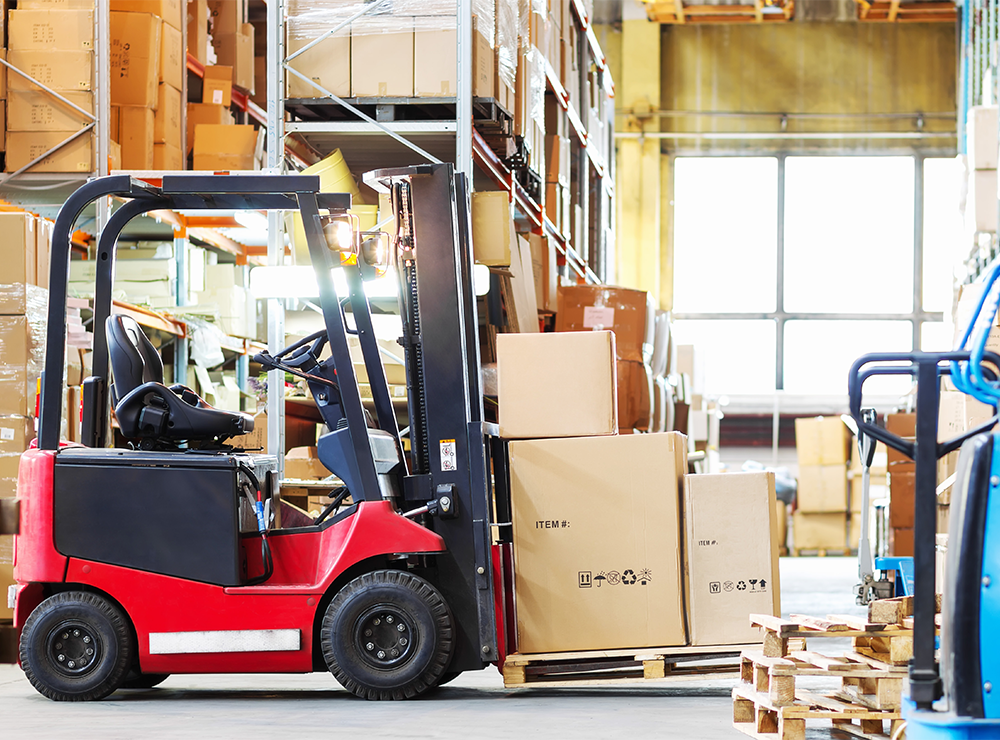 forklift holding a pallet in a warehouse