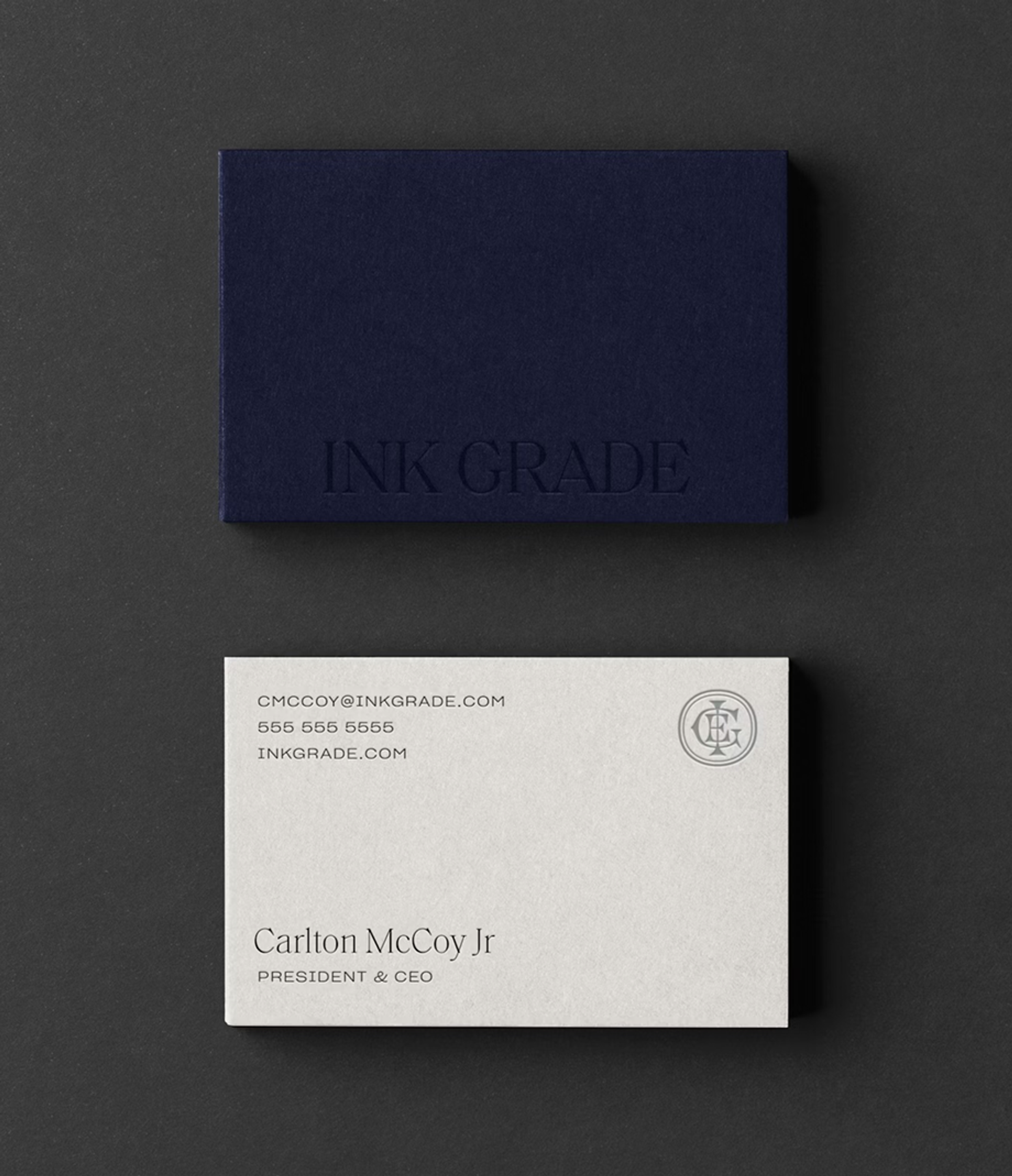 The brand system is anchored by a bespoke monogram and disciplined typography.