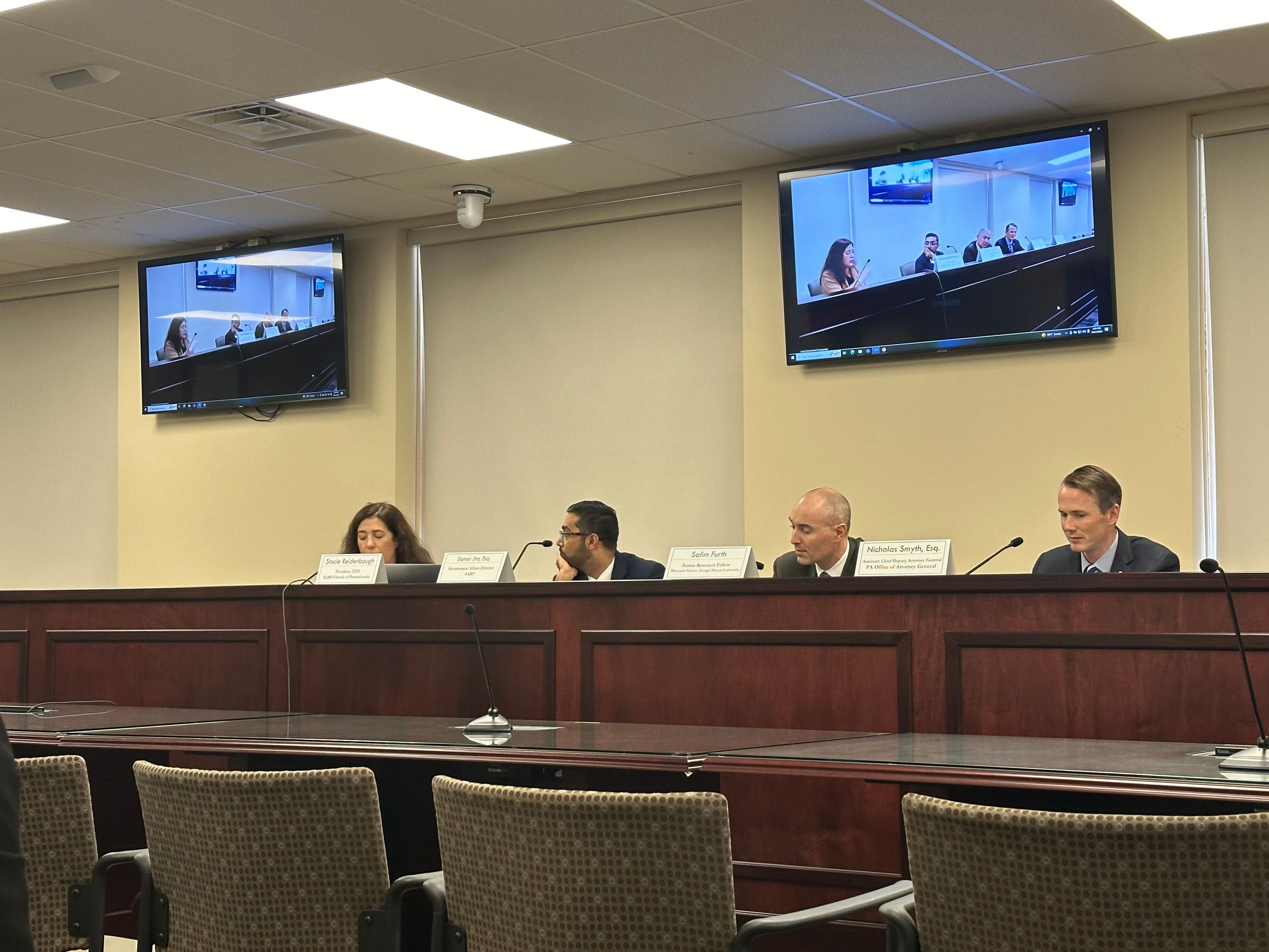 Panelists, discussing housing availability and affordability solutions